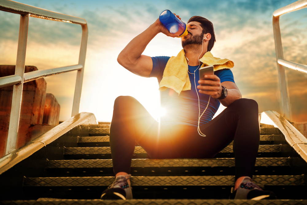 Man drinking from a sports bottle|How to build your collagen with sunwarrior|no hooves no hides no horns