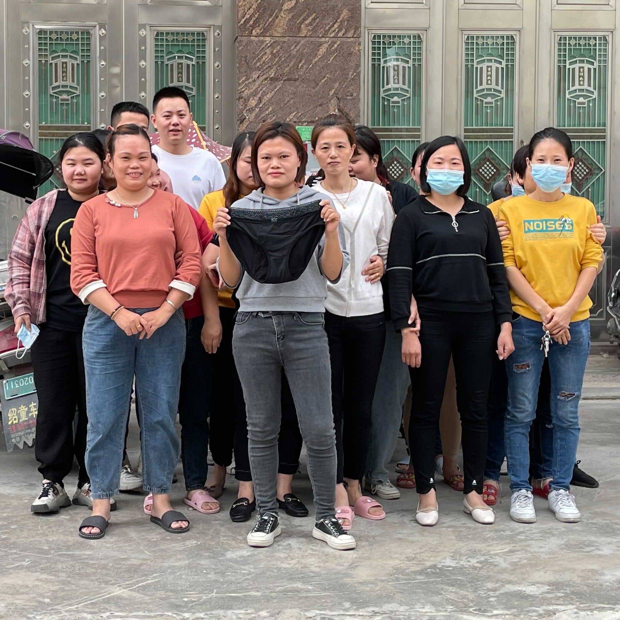 Shenzhen female-led factory holding up period pants that helped save their jobs and factory.