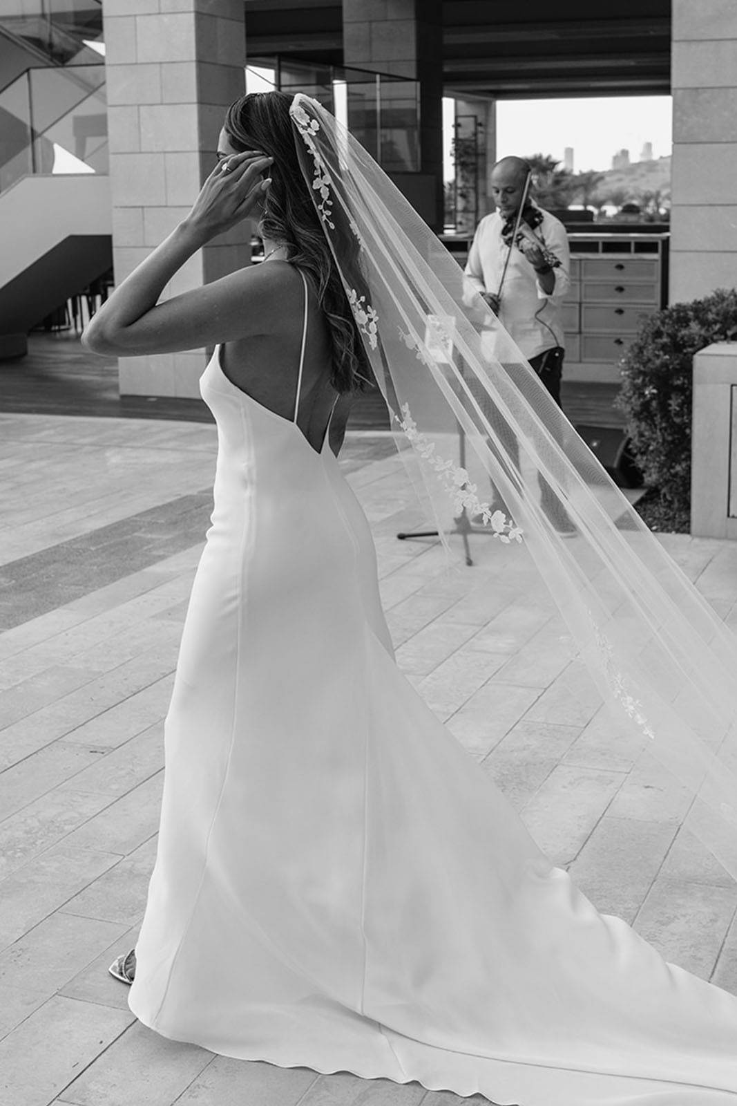 Bride's outfit, showcasing the bride's elegant back.