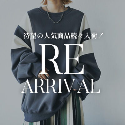 Person wearing a stylish oversized sweatshirt, with text 