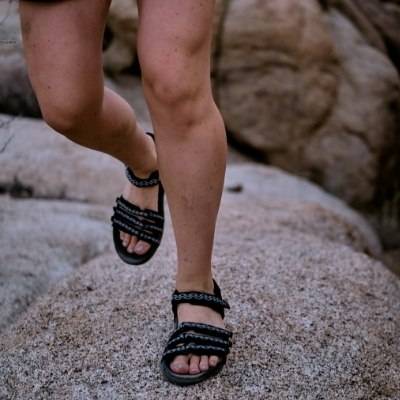 woman on rocks with Napali hiking sandals