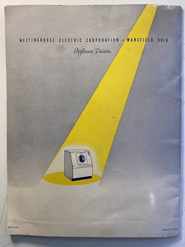 The back cover of a Westinghouse Laundromat clothes washing machine brochure. Featuring the machine slightly off center with a spotlight shining on it.