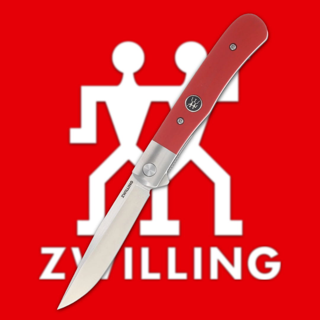 Red folding knife on a red background with Zwilling logo.