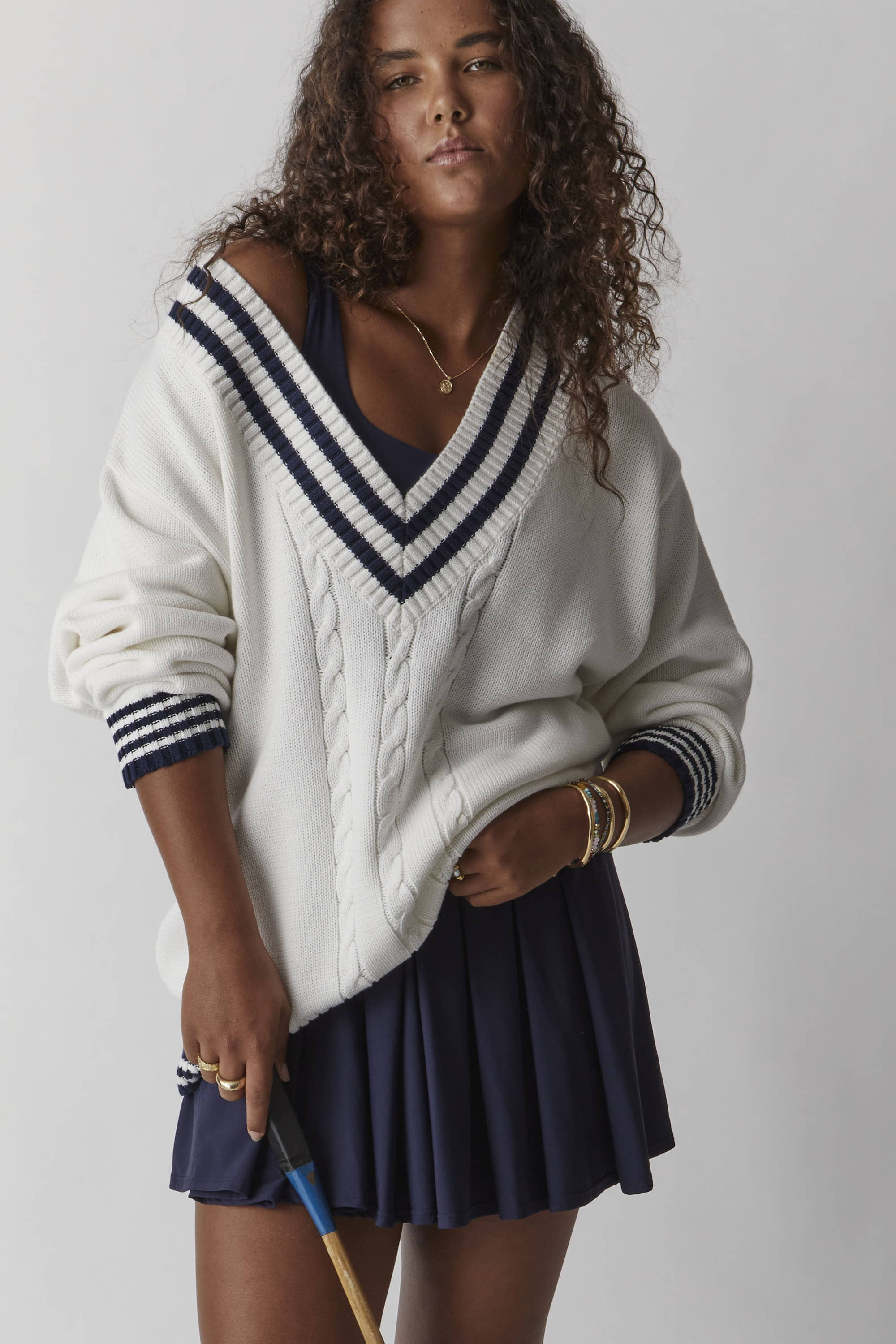 THE UPSIDE white Louie Sweater worn with the blue Peached Lucette Dress. Shop knitwear.