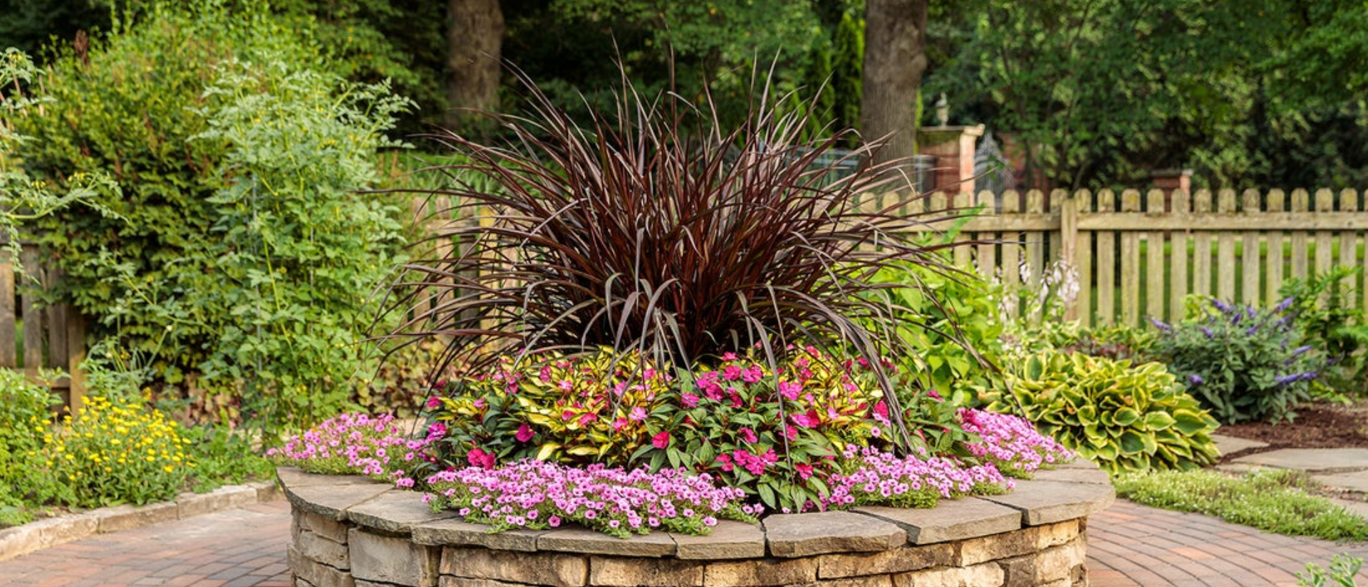  SunPatiens® Compact Neon Pink, Supertunia Mini Vista® Hot Pink, SunPatiens® Compact Tropical Rose, Graceful Grasses® Vertigo® 