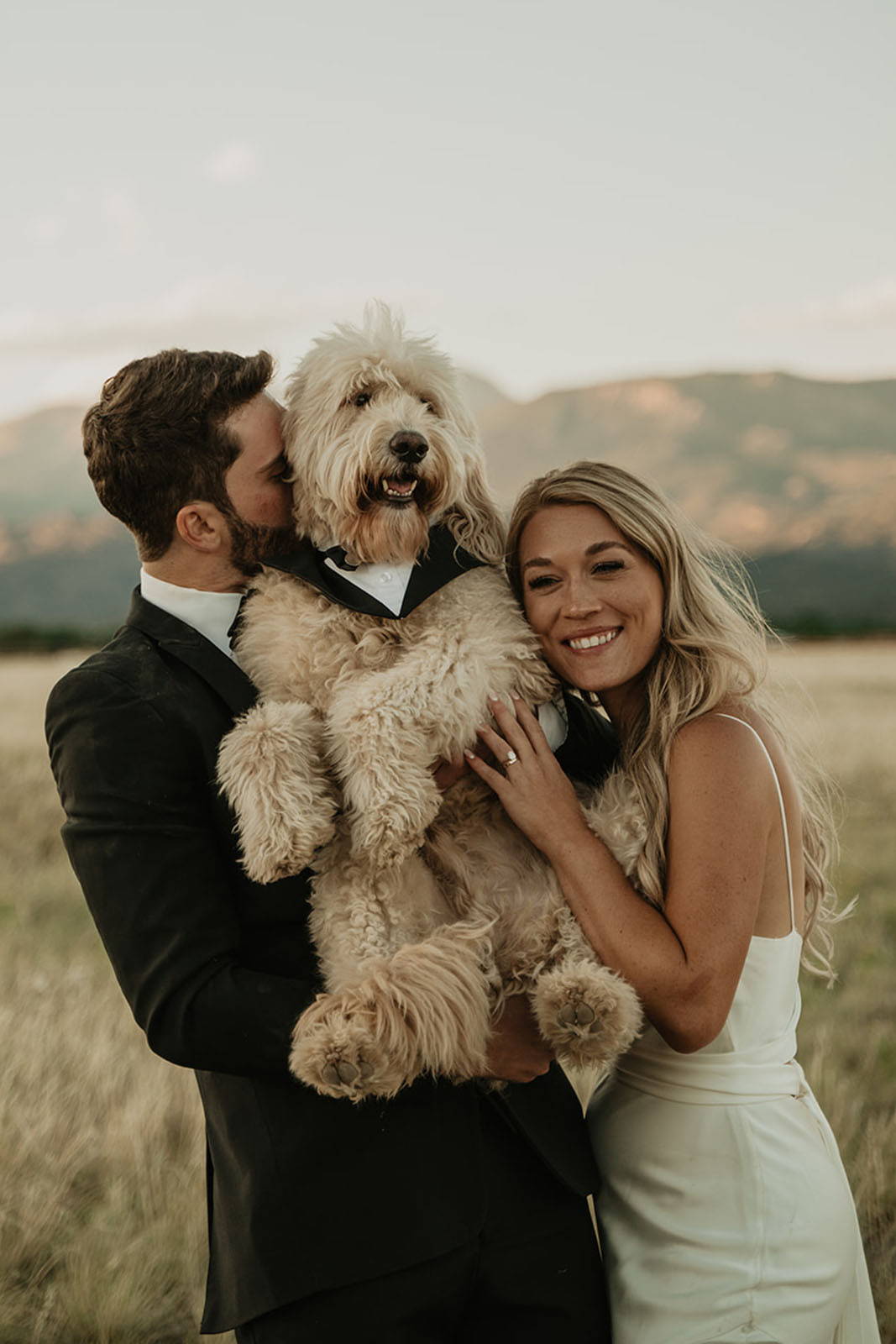 Bride and groom with their cute dog