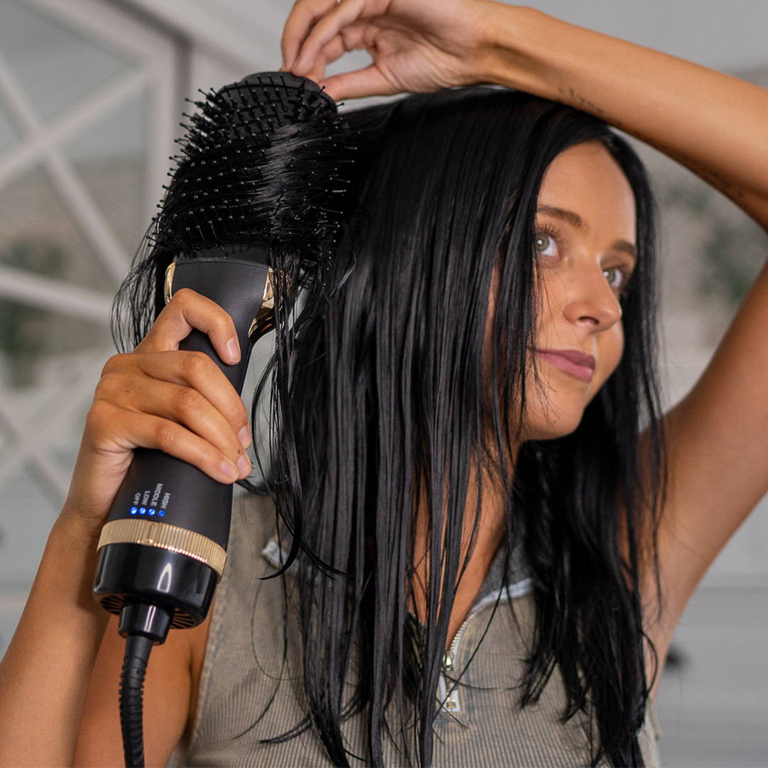 Woman blowdrying hair with BlowBrush Blowdryer Brush