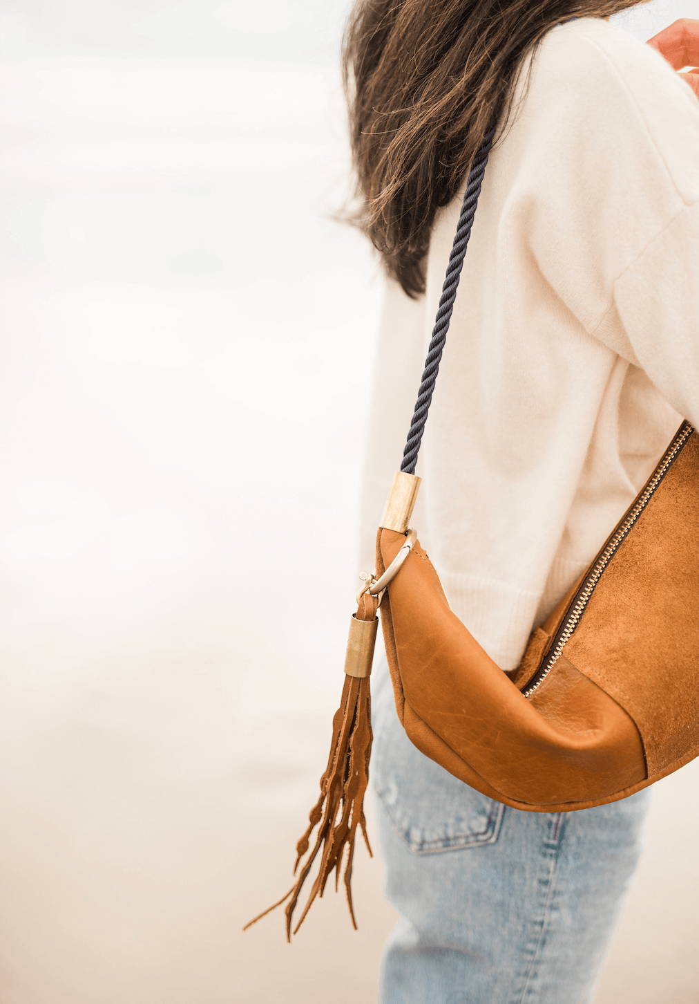 sling bag in beach nut leather and tassel