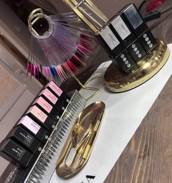 Nail polish bottles and accessories displayed on a stylish surface.