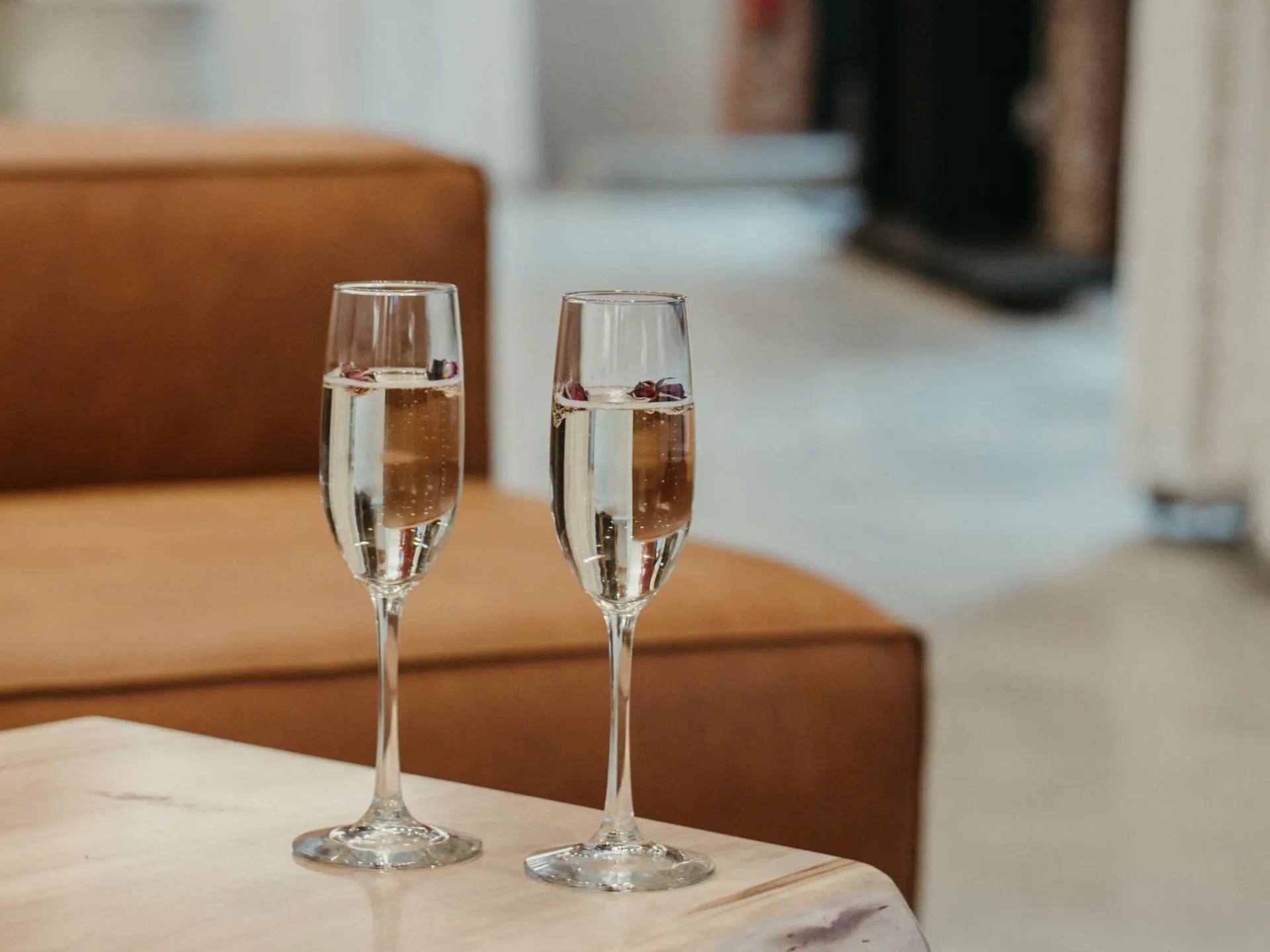 Two filled champagne glasses