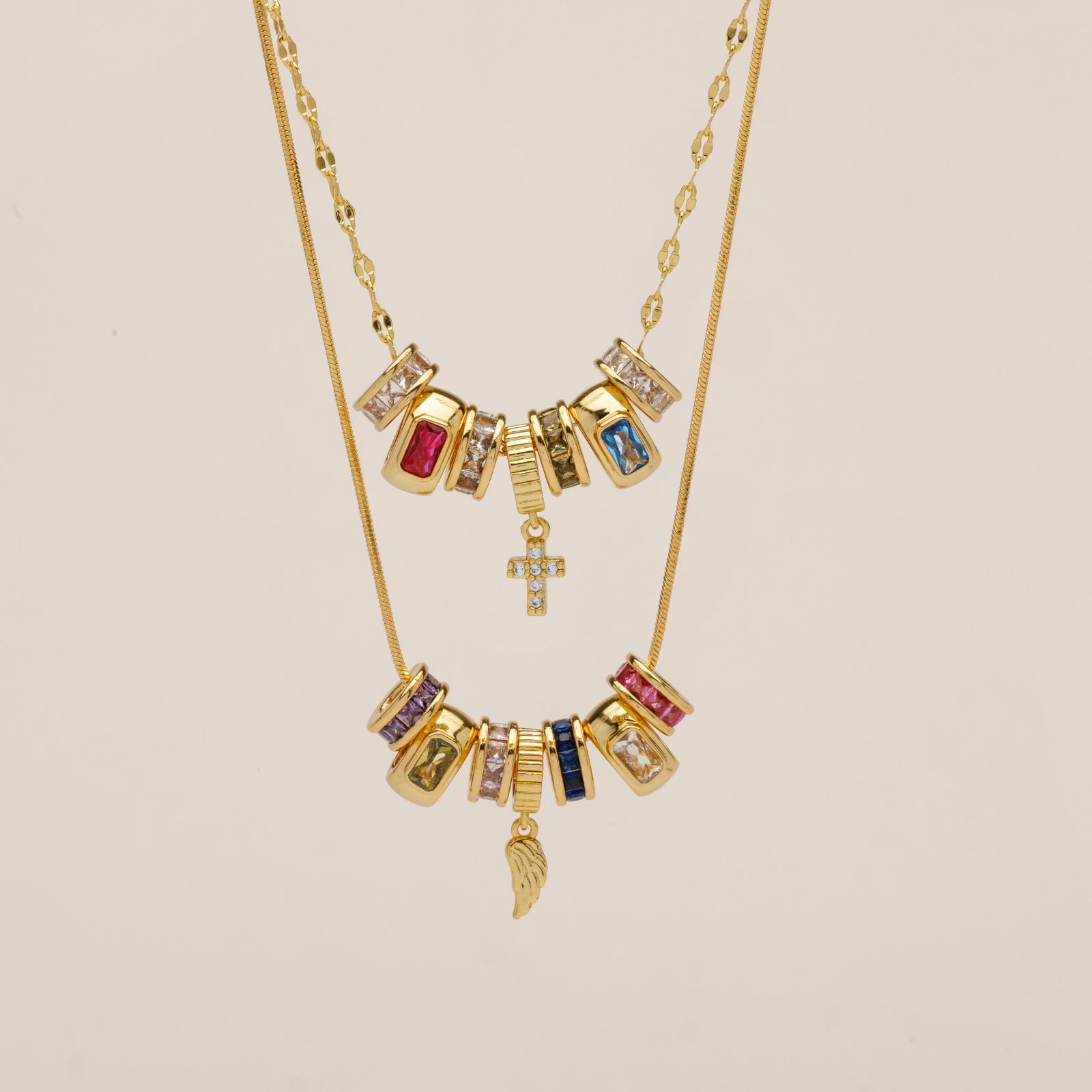 Layered gold charm necklaces with birthstones and dangles for personalized keepsake jewelry