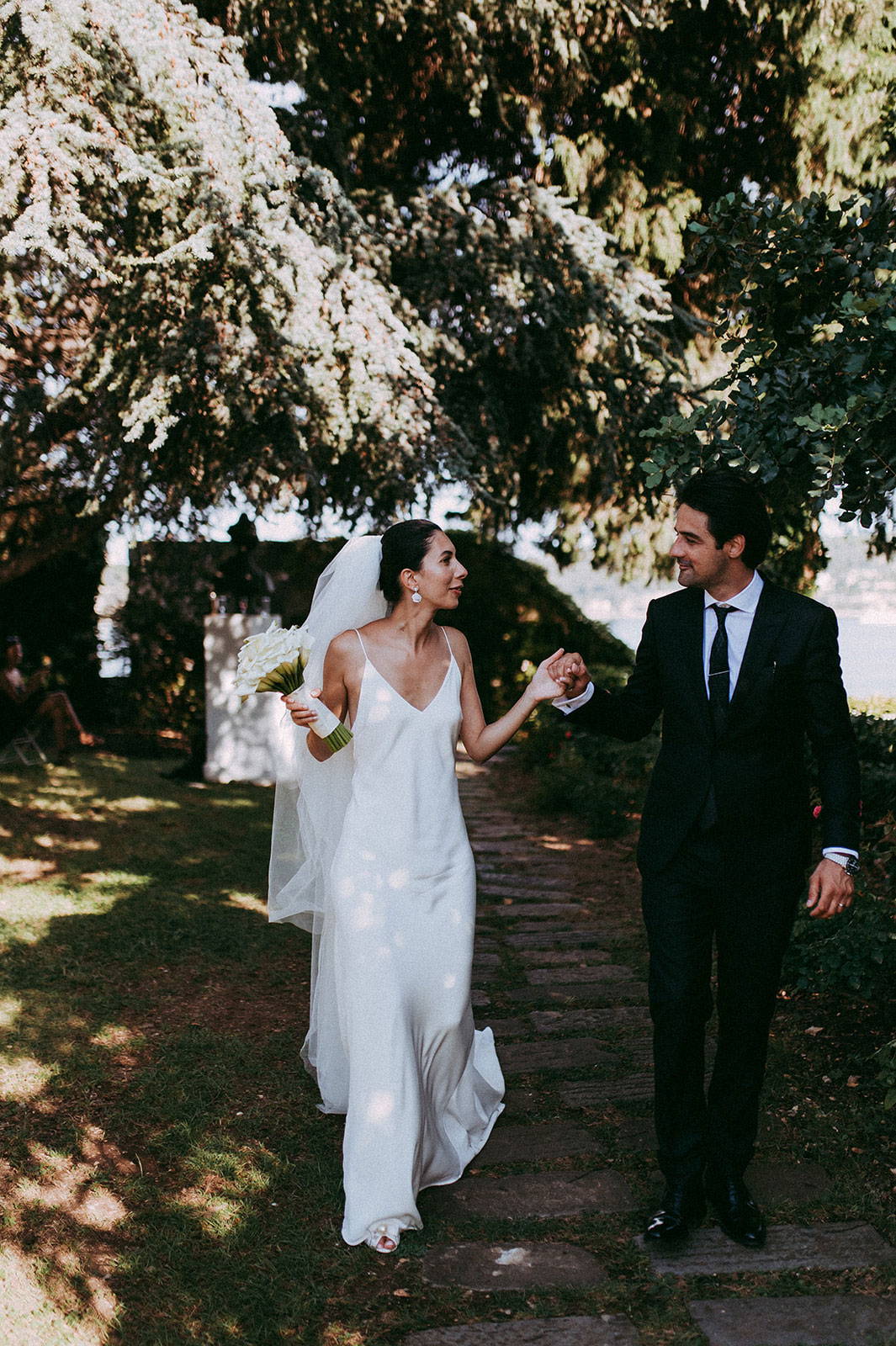 Bride and groom holding hands