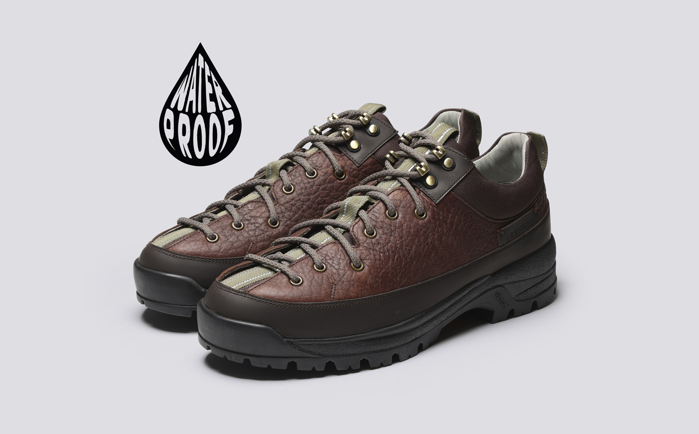 grenson Sneaker 70 - Brown waterproof hiking shoes on a gray background.