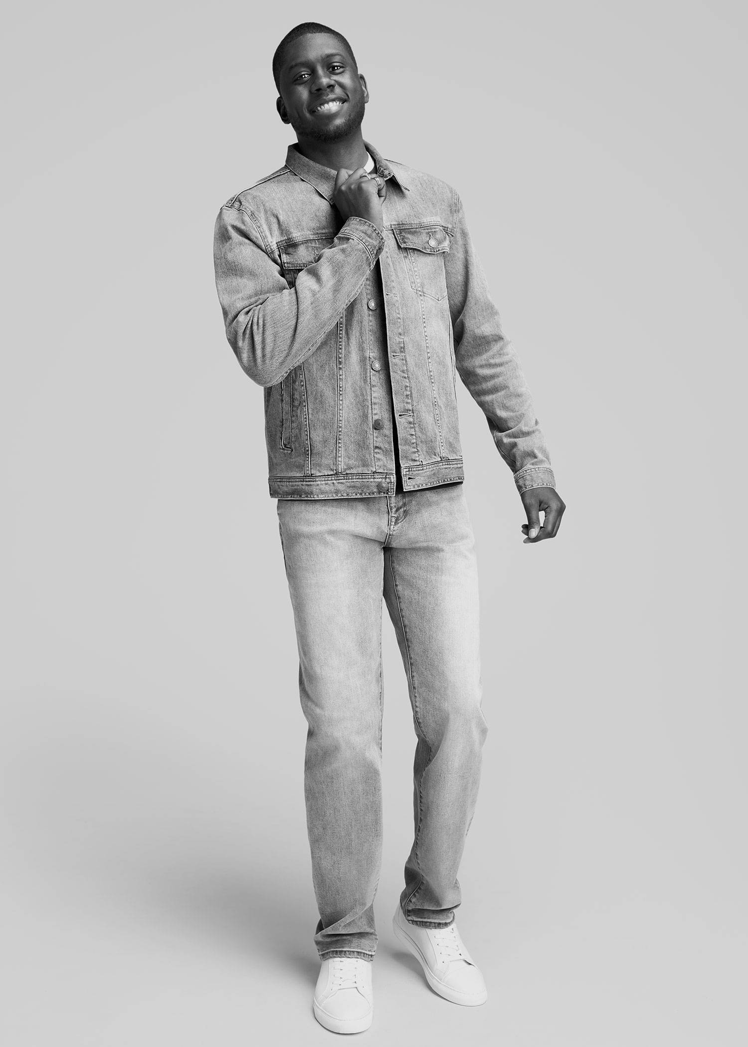 Tall man wearing a light denim jacket and jeans