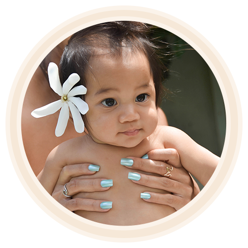 hawaiian baby held by mother wearing non toxic nail polish