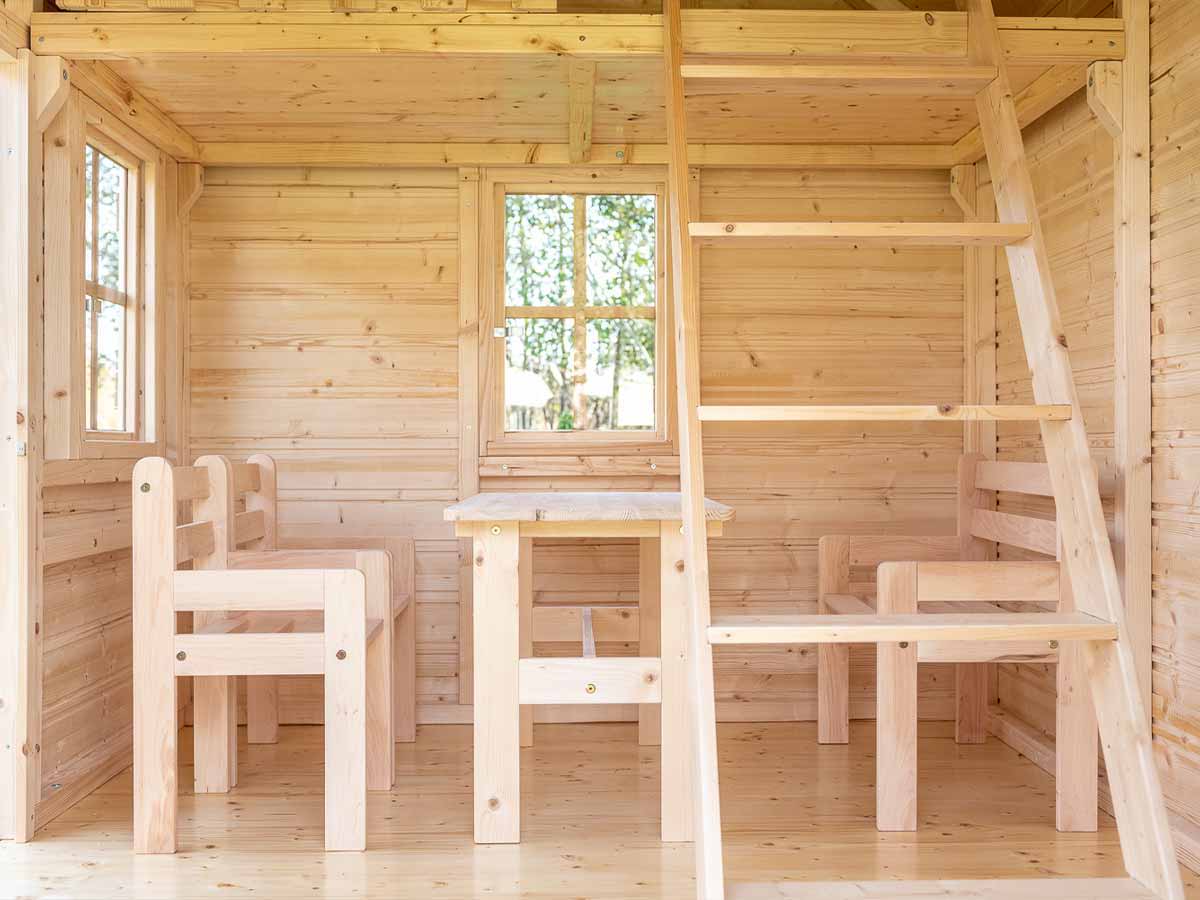 Outdoor Playhouse Natural Wonder inside view with kids furniture by WholeWoodPlayhouses