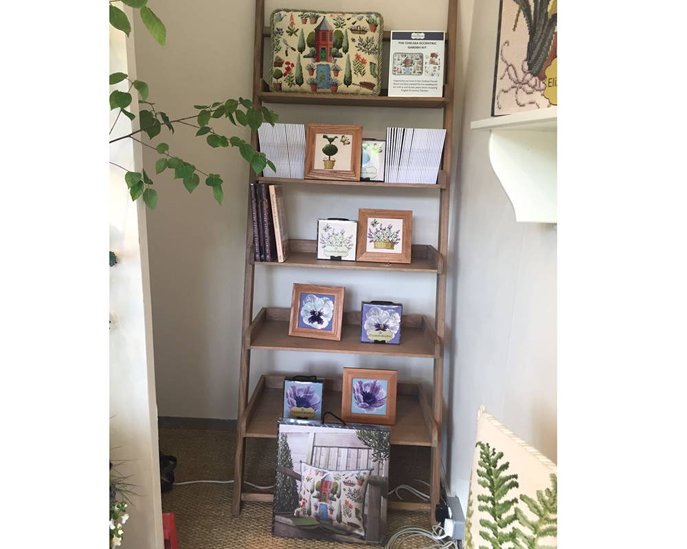 Shelf with mini kits, catalogs, and books