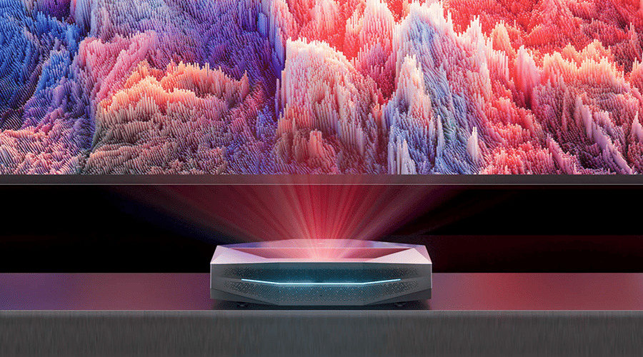 A projector displaying colorful graphics on a large screen.