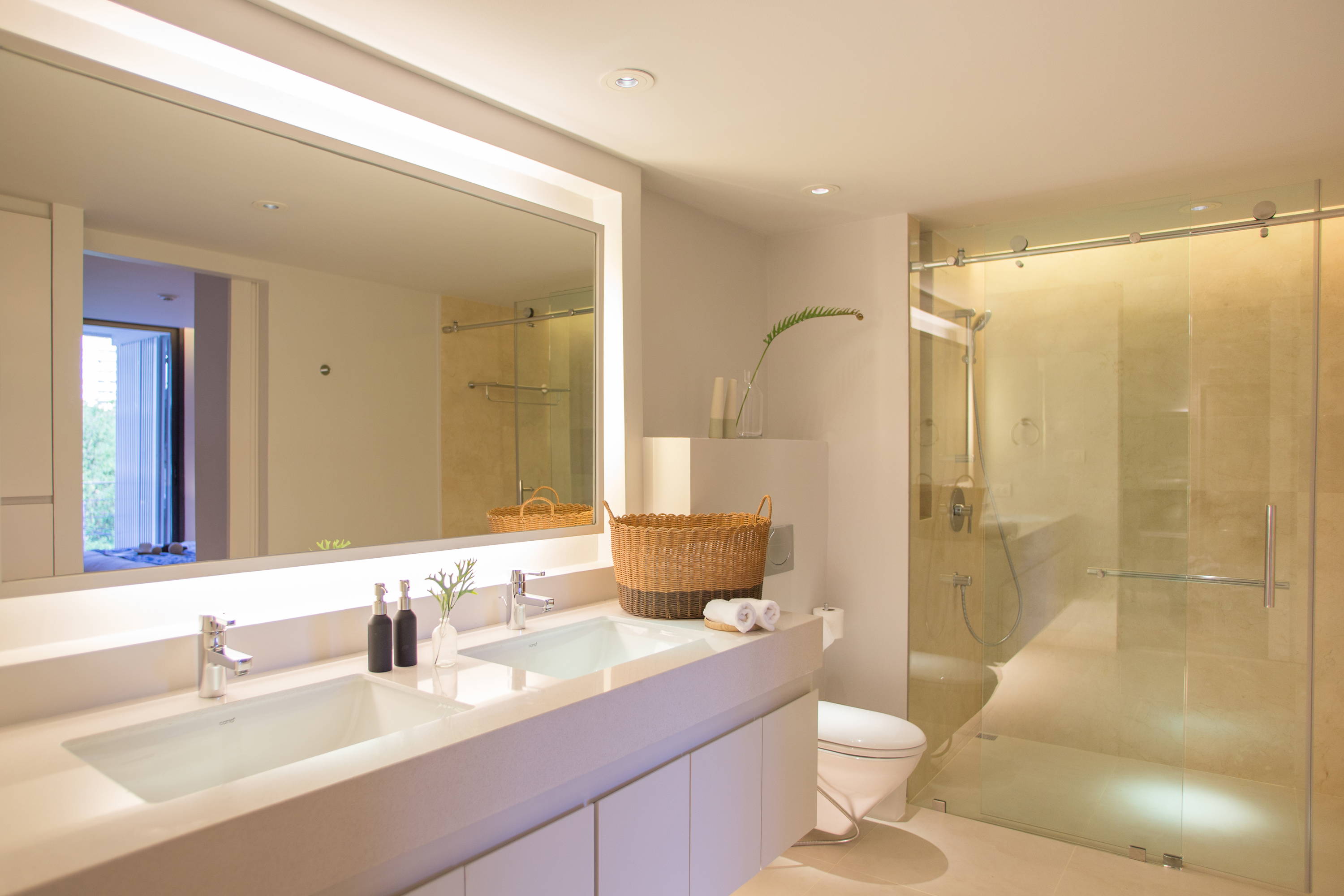 Frameless shower doors and glass vanity mirrors