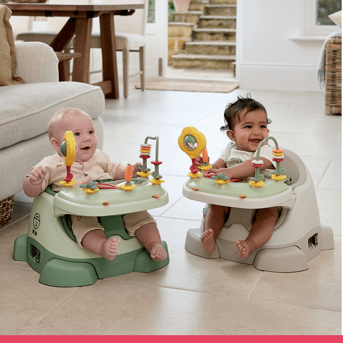 Two babies in activity seats playing with colorful toys.