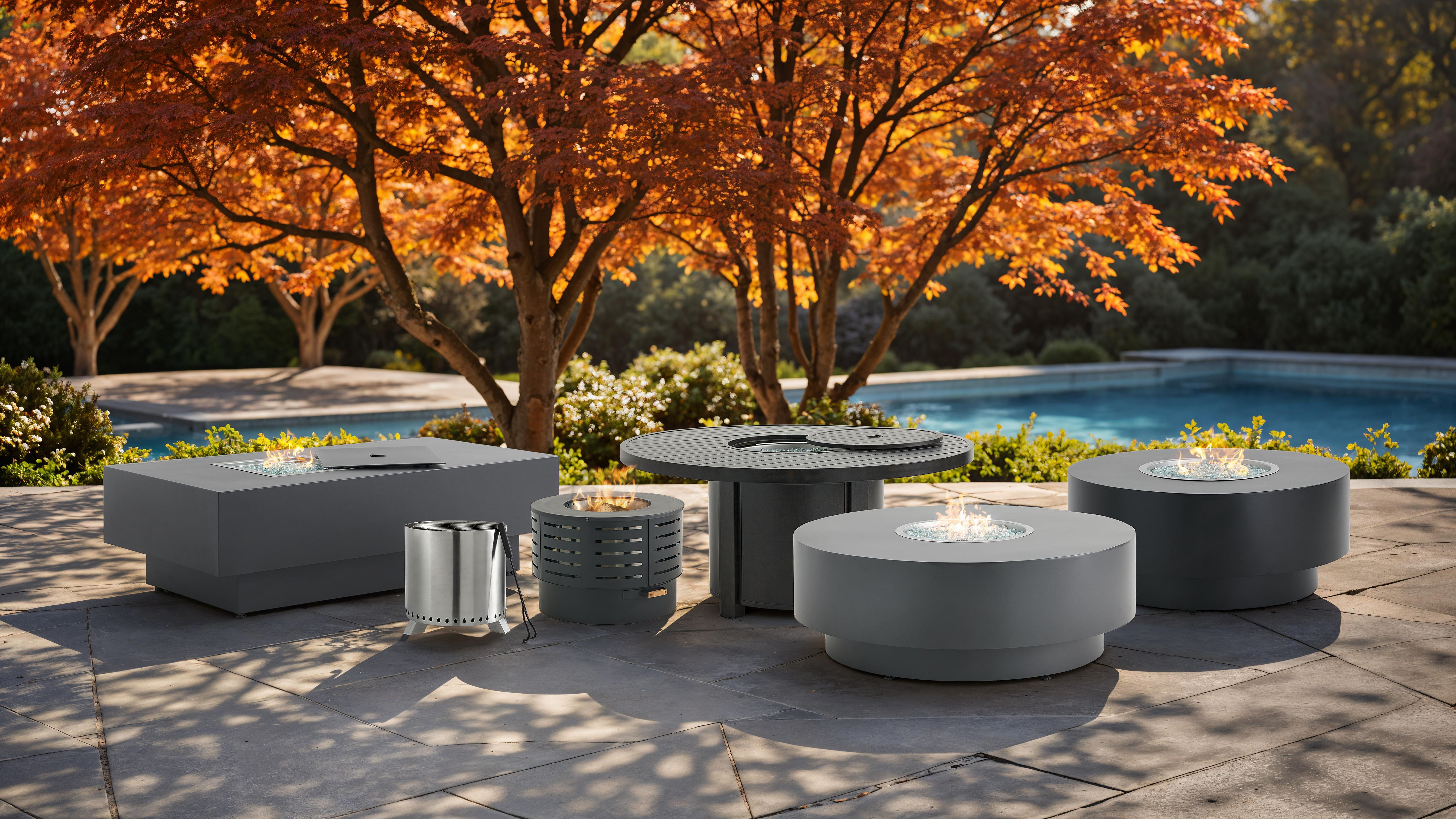 Modern outdoor furniture by a pool with an autumn tree backdrop.