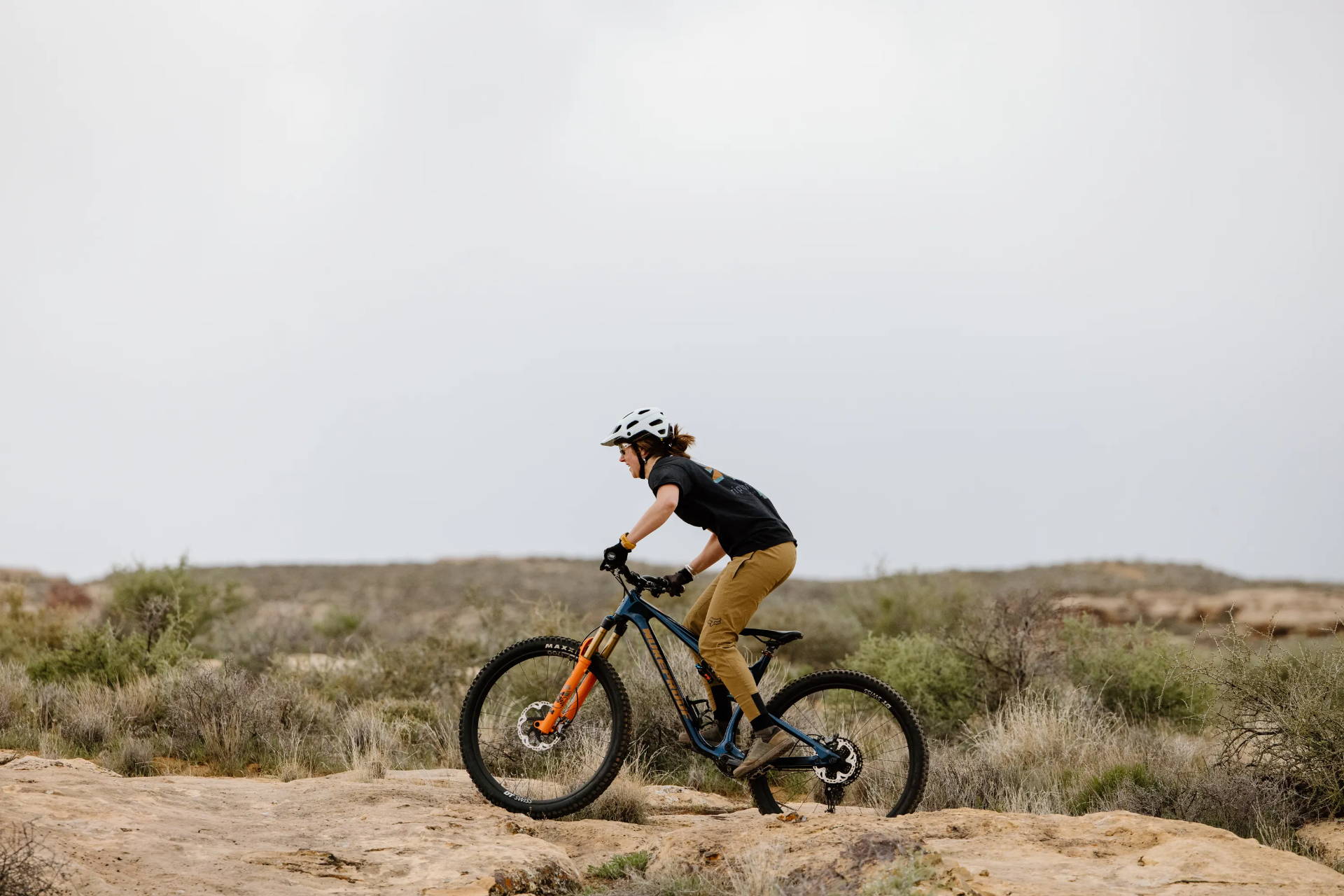 A rider on the Nukeproof Reactor mountain bike.