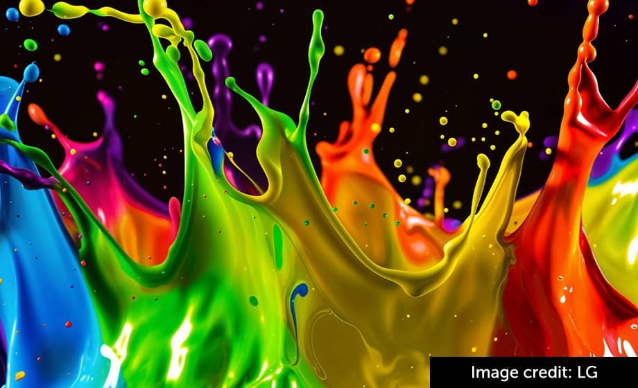 Colorful paint splashes against a black background.