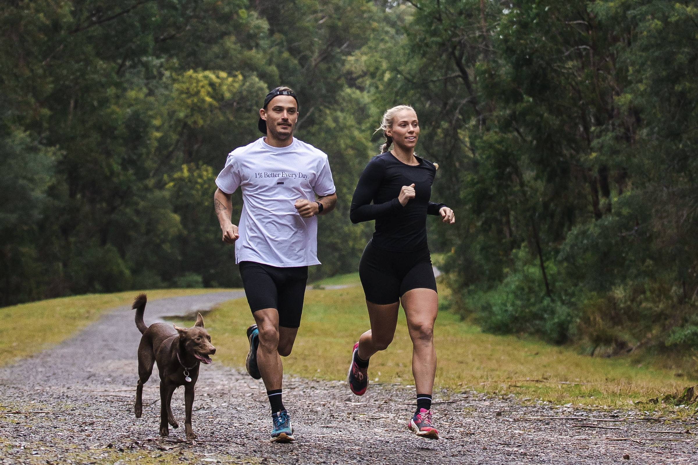 a male and female trail running