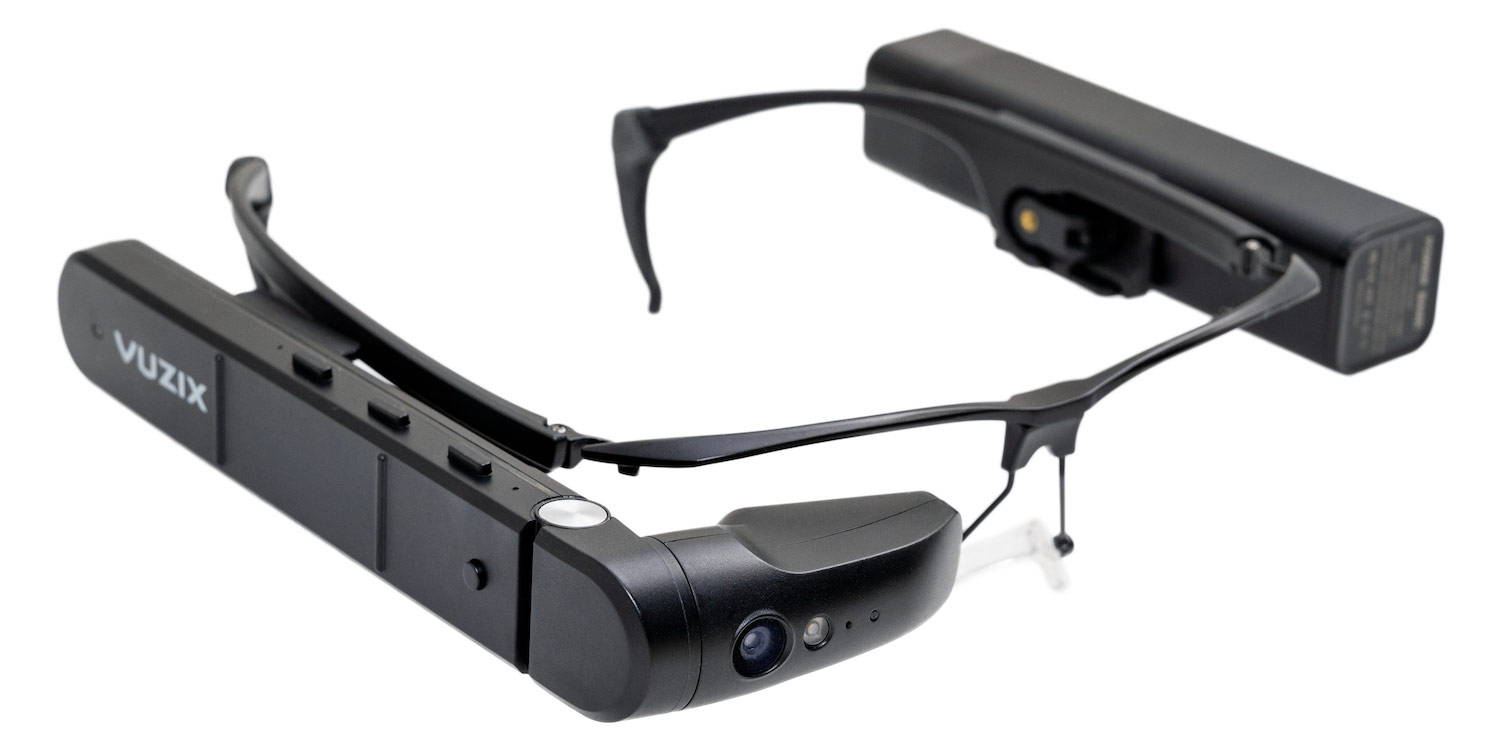 Angled side view of lightweight Vuzix M400 lensless eye frames with camera and flashlight pointed lower right.