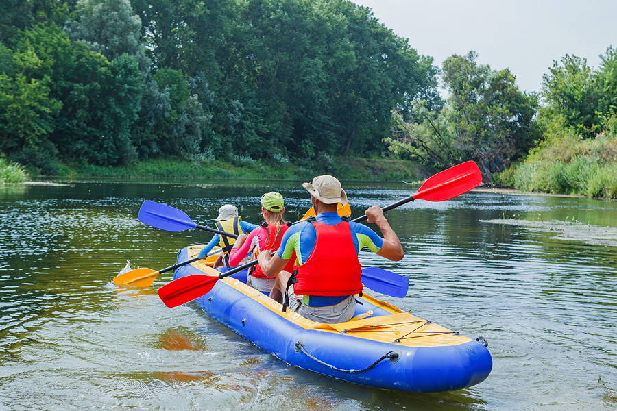 Family kayaking on the water