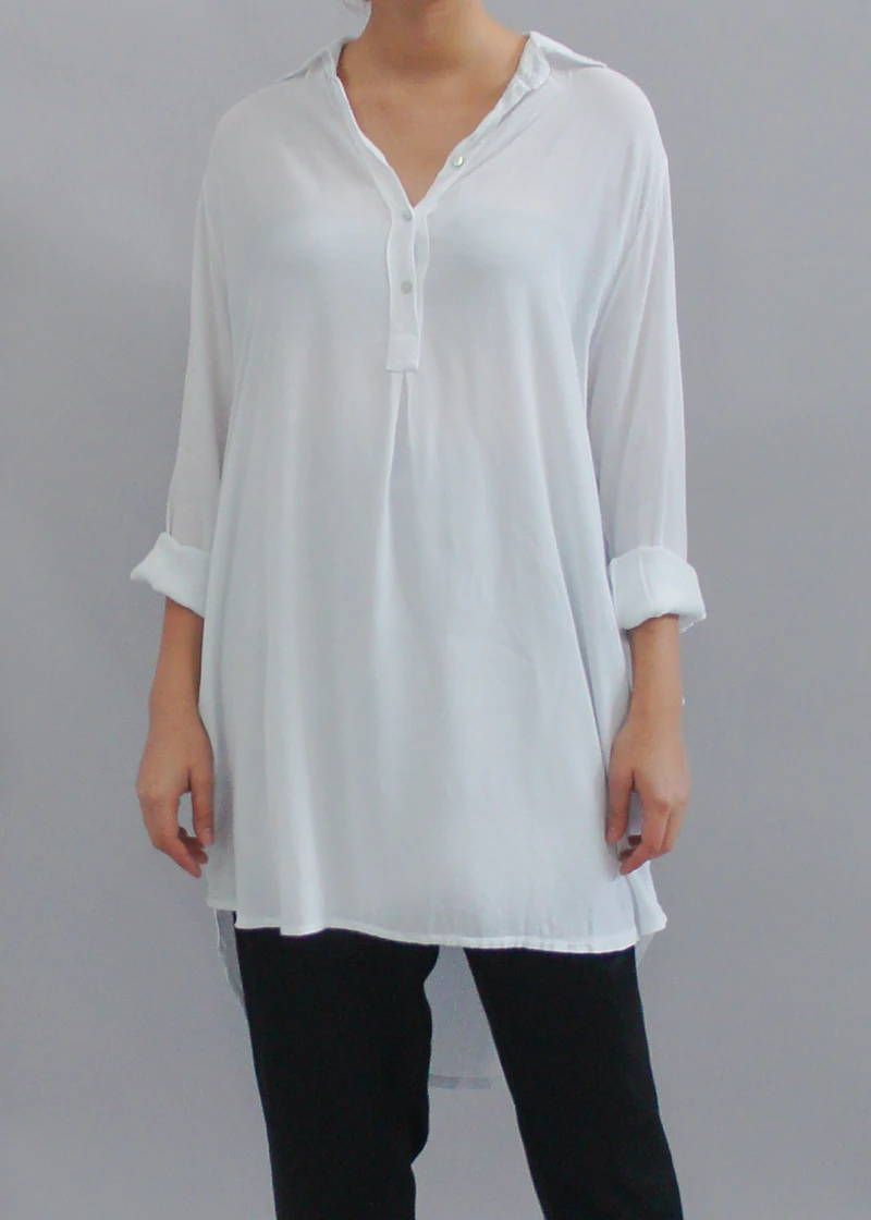 A model wearing a white long shirt