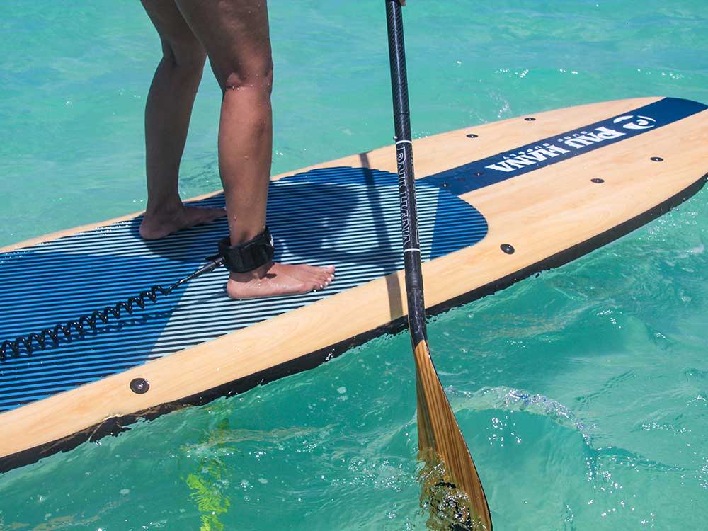 standing on the pau hana big ez vft paddleboard