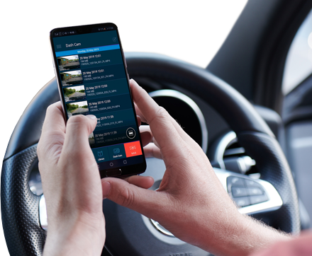 Person using a smartphone while sitting in a car.
