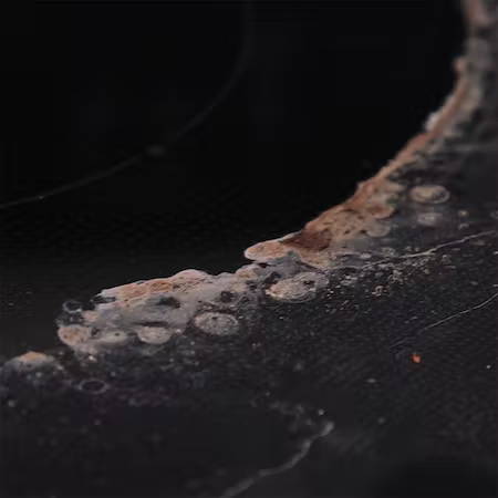 cleaning burned-on spills on glass cooktop