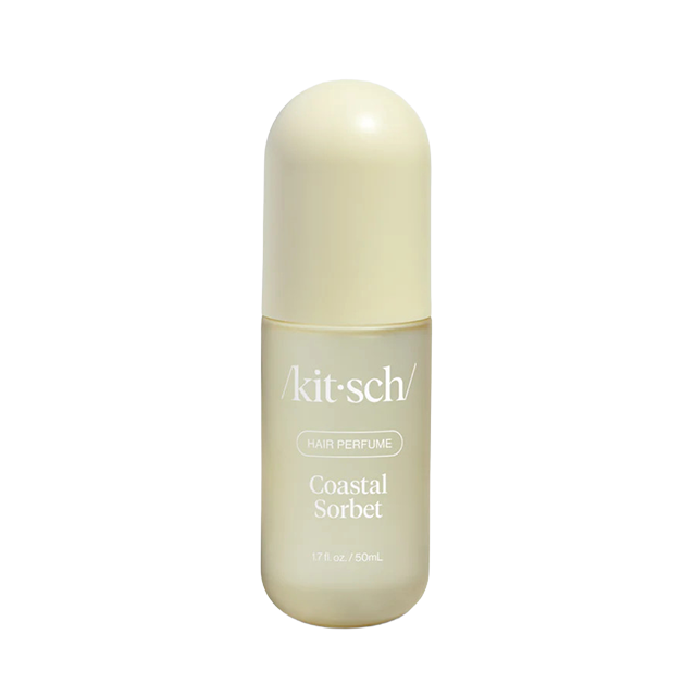 Kitsch Coastal Sunset perfume bottle with cream-colored cap and label.