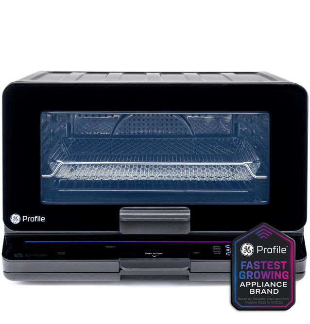 Black countertop oven with transparent door and branding on the side.