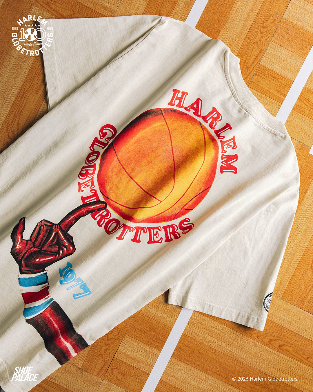 Harlem Globetrotters t-shirt featuring a basketball and colorful graphic design.
