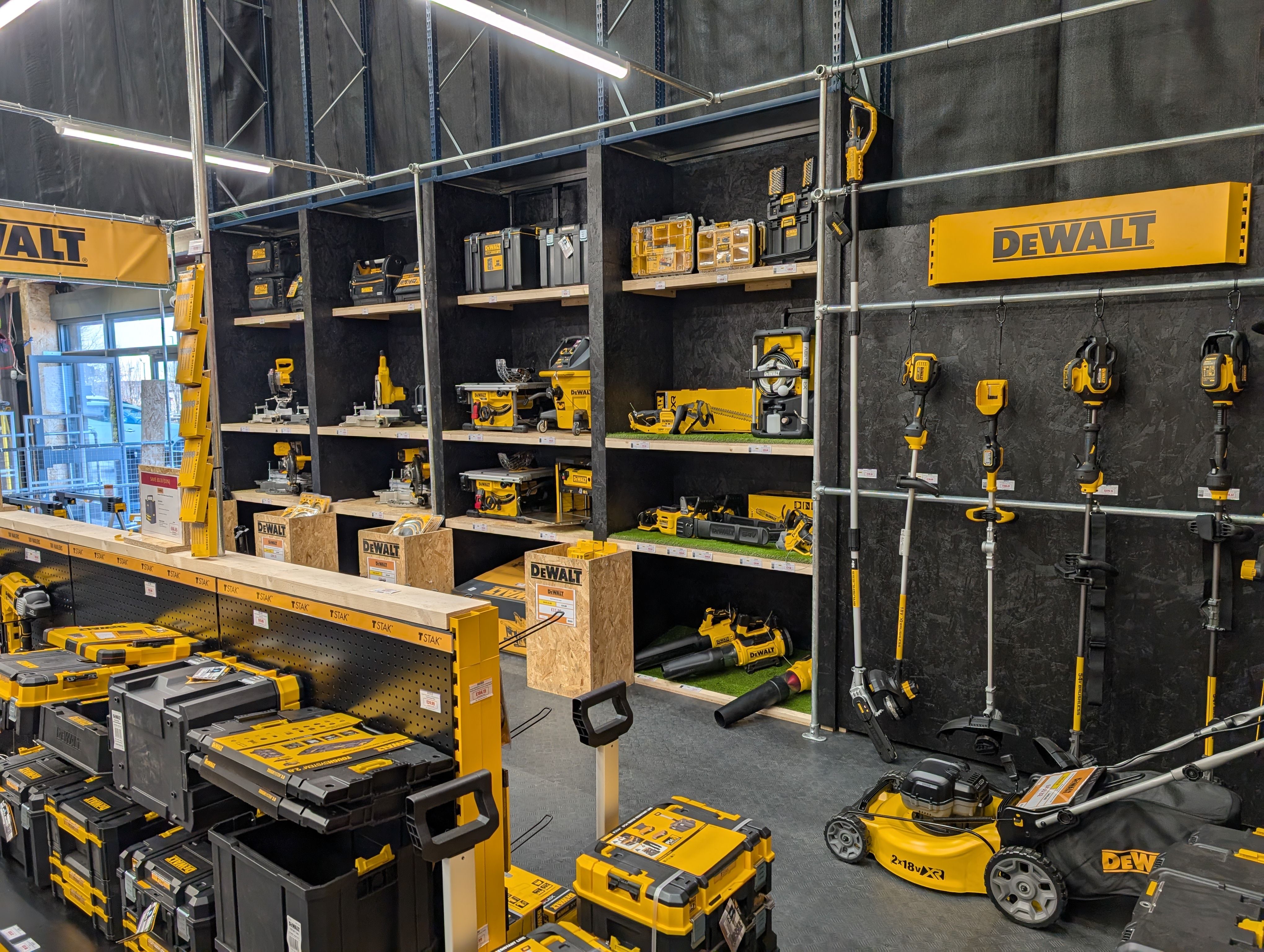 Display of DeWALT tools and equipment in a retail setting.