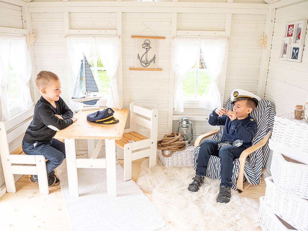 Boys Playing inside of Outdoor Playhouse Bluebird by WholeWoodPlayhouses