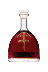A round glass bottle containing red liquid with a decorative label.