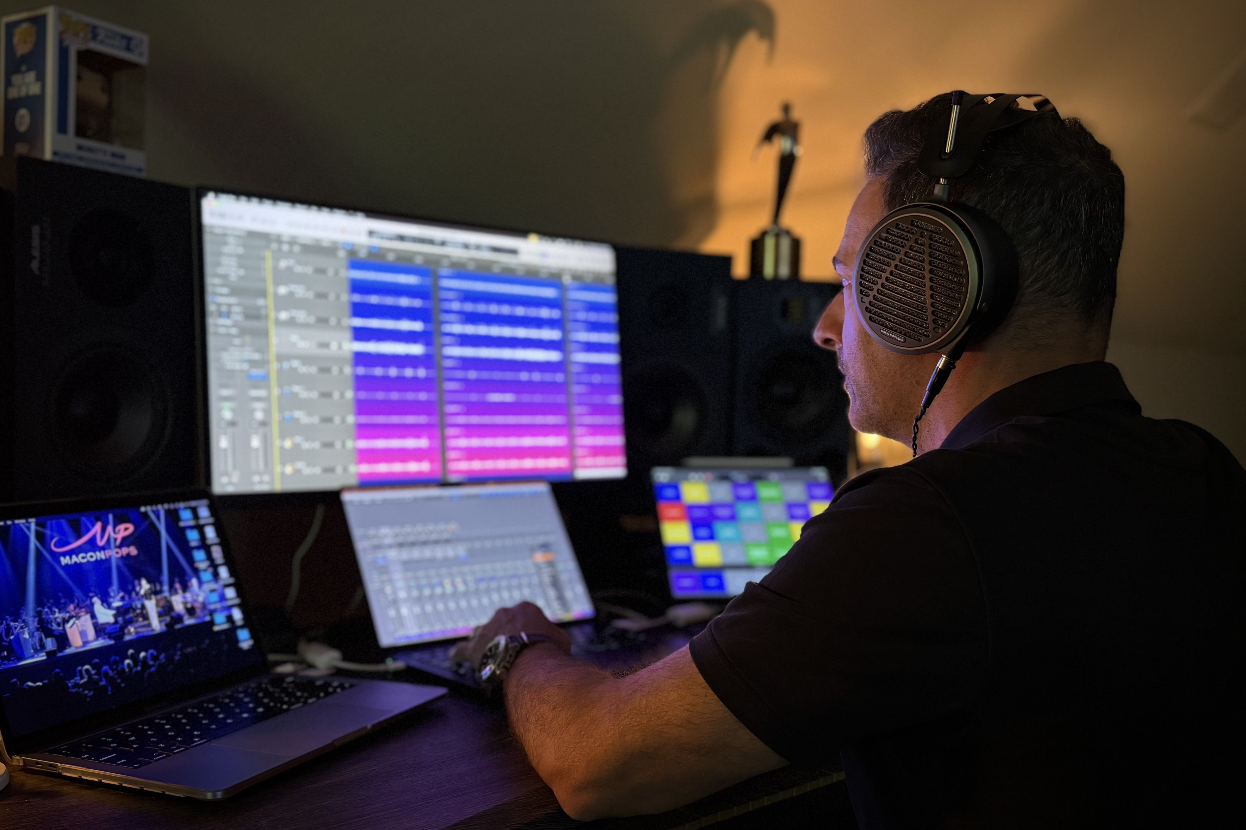 Steve Moretti wearing Audeze MM-500 headphones mixing in the studio 