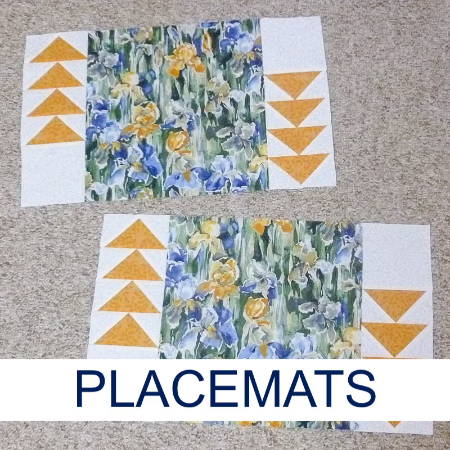 Two finished placemats with flying geese used on the borders