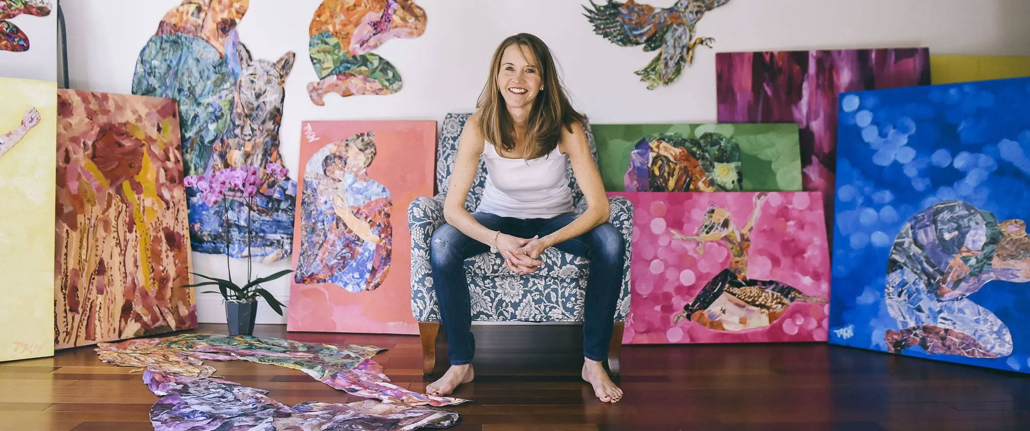 Meghan Nathanson sitting with collage art