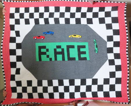 Racecar appliqué with yoyos and buttons as tires