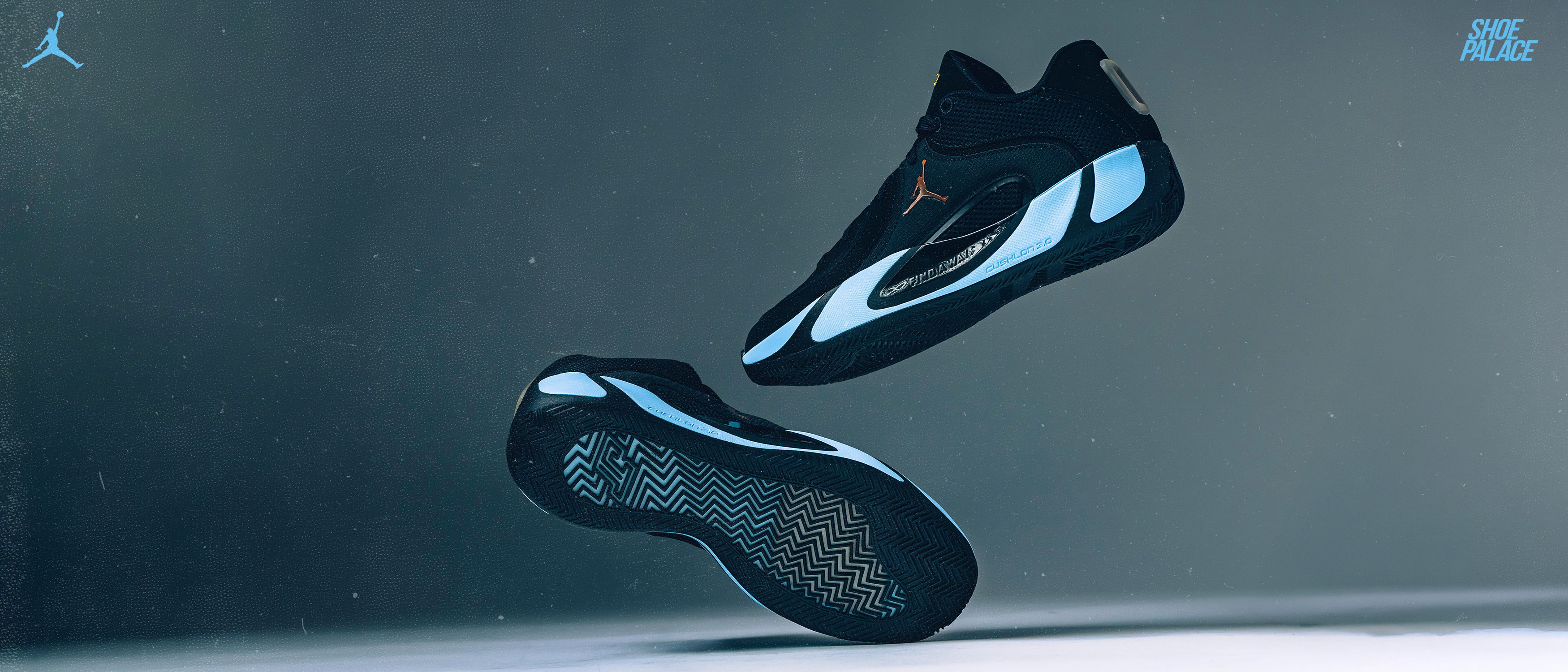 Black and blue athletic shoes floating against a dark background.