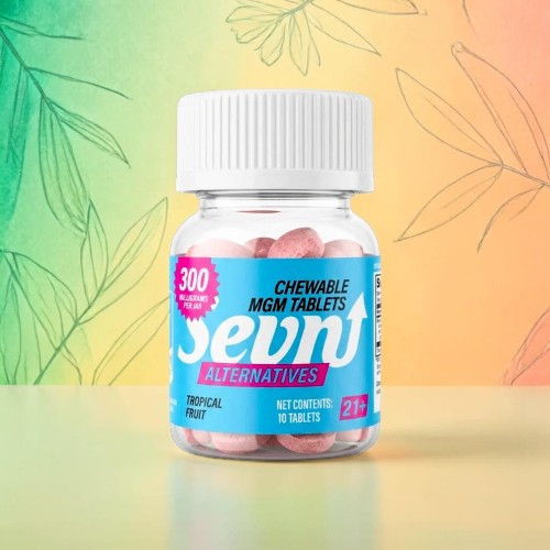 Bottle of chewable magnesium tablets on a colorful background.