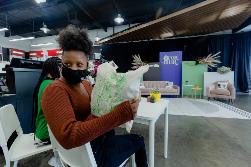 girl holding up bag at for her event