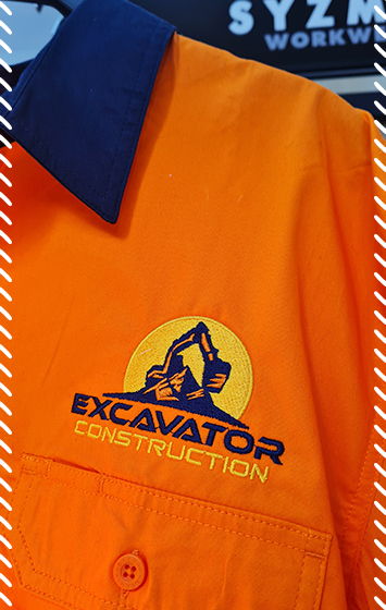 Orange hi-vis work shirt with embroidered Excavator Construction logo on the chest in navy and yellow thread