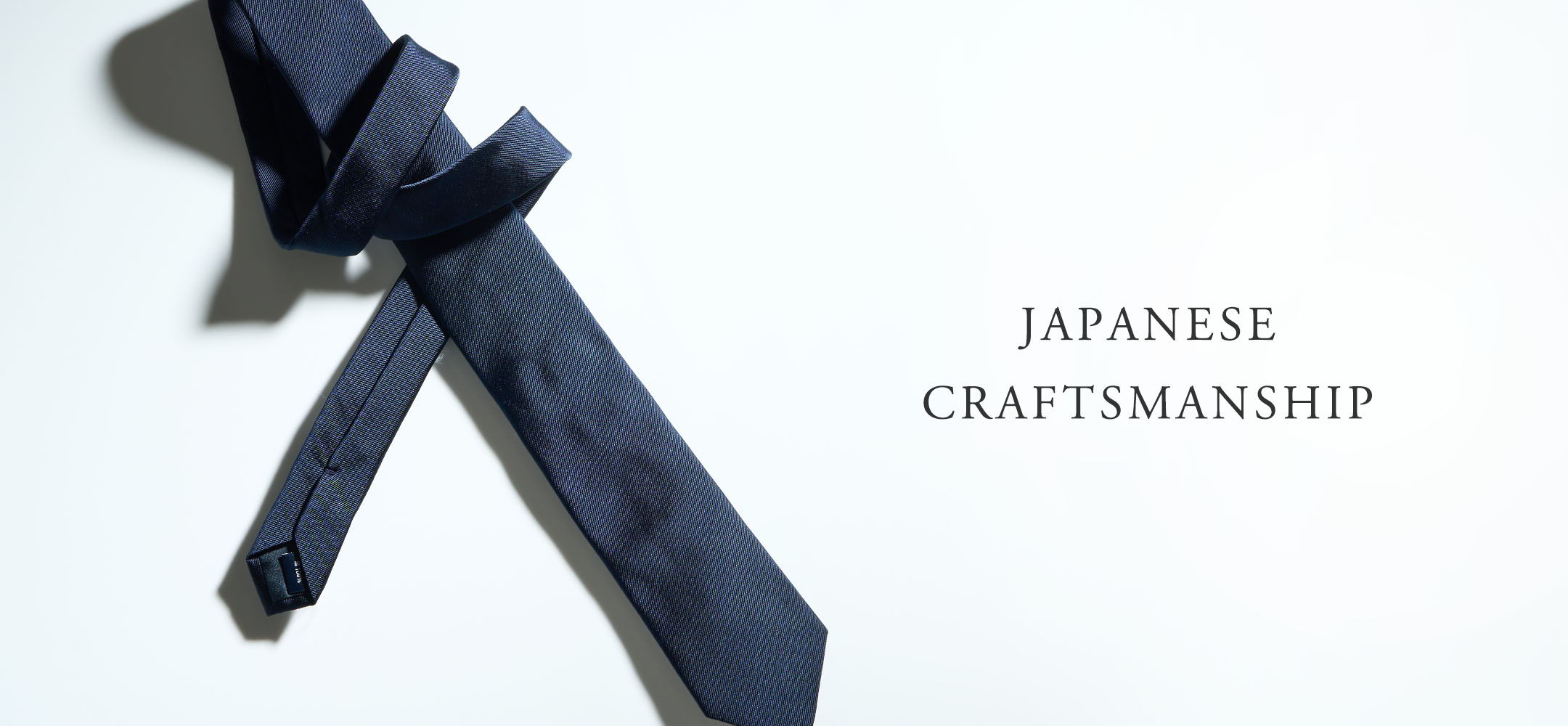 A navy tie with the text 