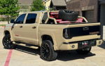 Rear three-quarter tan Tundra chase rack spare tire red LEDs QBALL TRD Texas plate LaQuentin's Conductor's Special 844 gallery photo 5